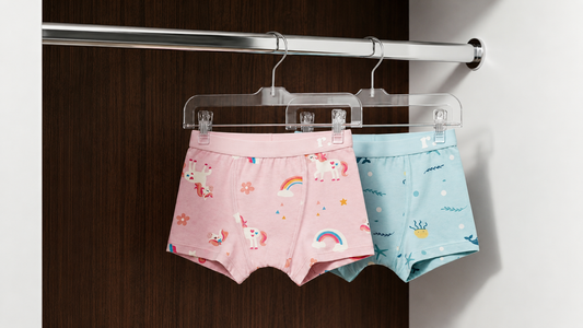 Rudie Baby toilet training underwear hanging in a wardrobe, Unicorns and Whales prints, Australia