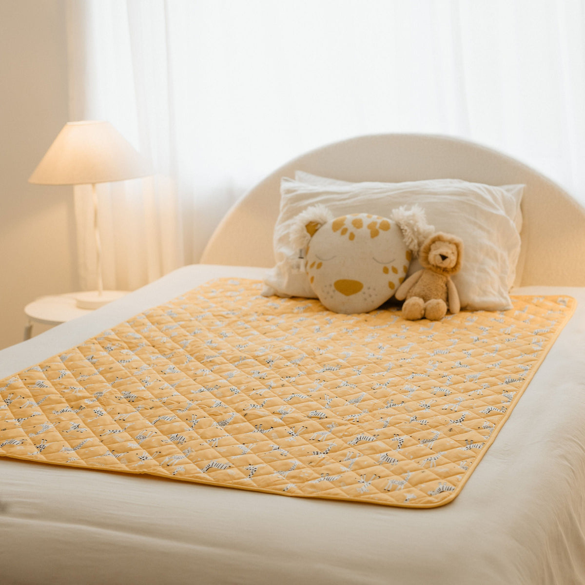 Rudie Baby leakproof bed guard on bed, lifestyle photo